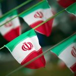 FILE PHOTO: Iran’s national flags are seen on a square in Tehran