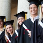 Close-up of five graduates posing