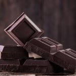 Dark chocolate stack, on wooden table,chocolate concept background