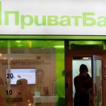 File photo of a man leaving branch of Privatbank in Kiev