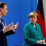 Austria’s Chancellor Sebastian Kurz talks during a news conference with German Chancellor Angela Merkel at the Chancellery in Berlin